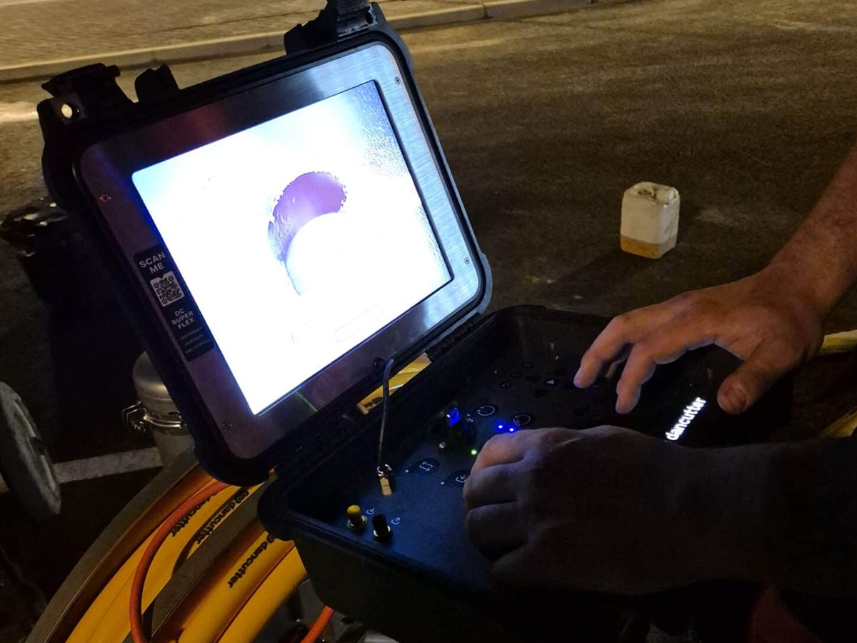 Close-up of a Dancutter robotic control screen showing the inside of a drainage pipe during milling.